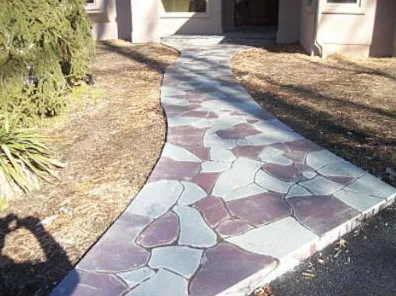 Curving multicolor flagstone walkway with a bluestone border
